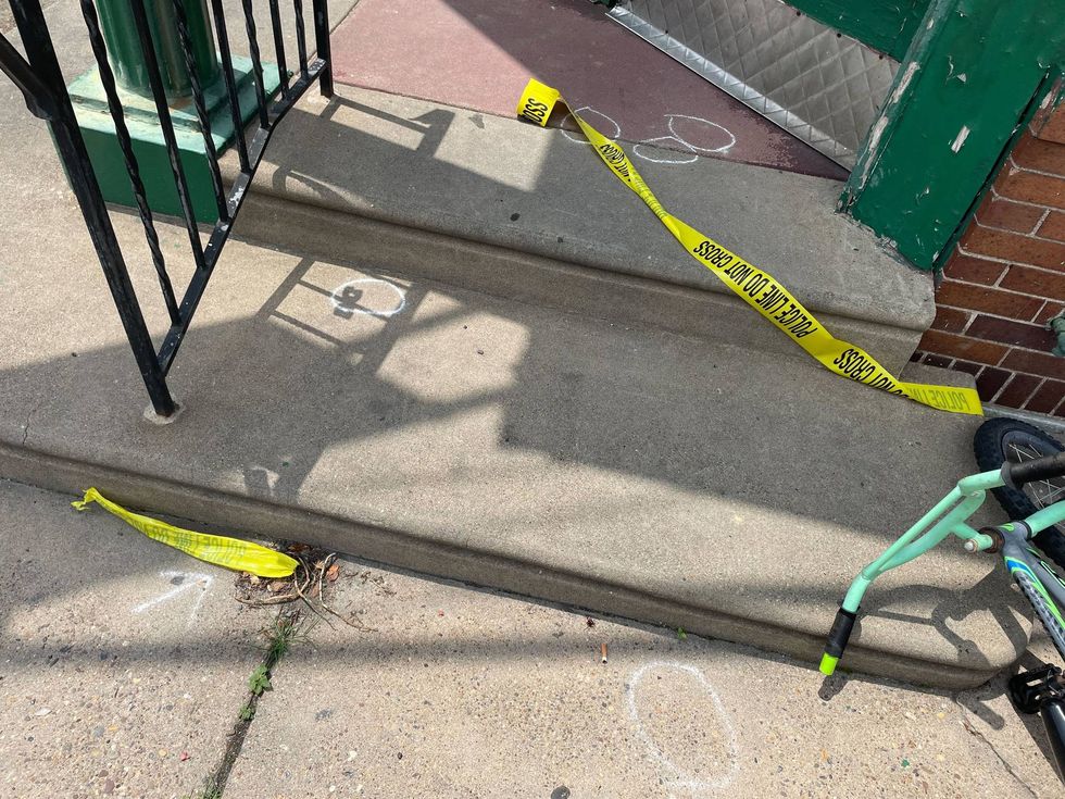 Chalk outlines bullet casings as police investigate the mass shooting in Kingsessing on July 3, 2023. A gunman opened fire and killed five people, including a teenager.