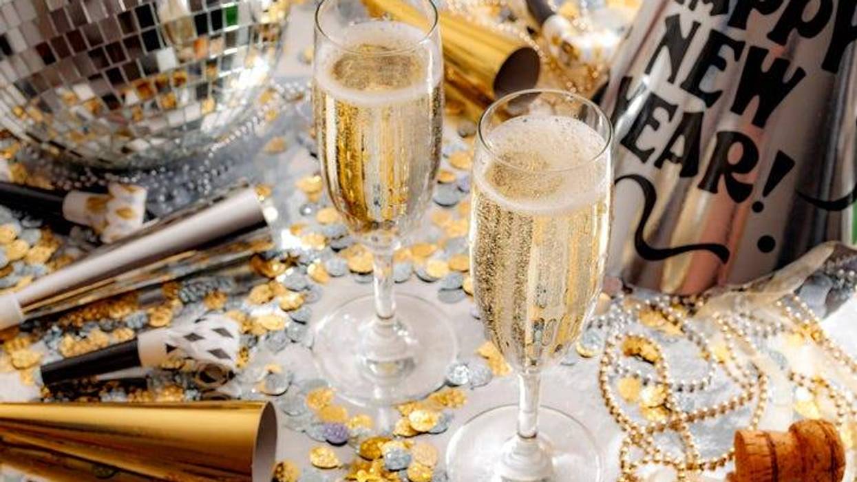 champagne glasses and new year's hat