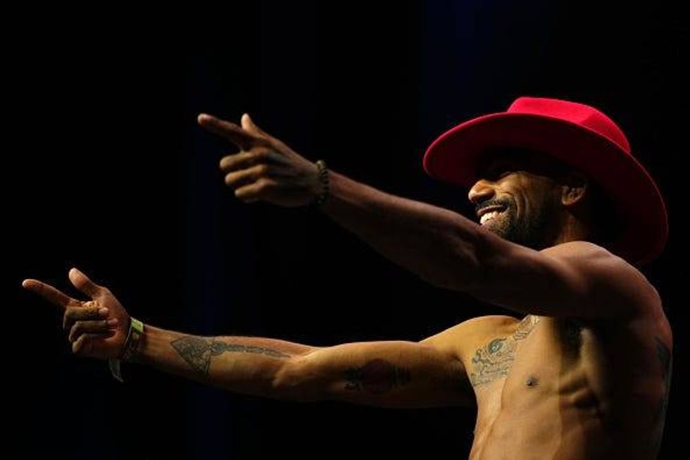 Charles Johnson poses on the scale during the UFC Fight Night ceremonial weigh-in at Enterprise Center