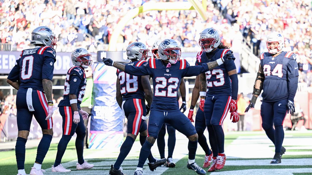 Charles Woods #22 of the New England Patriots celebrates with teammates after an interception against the New York Jets during the fourth quarter at Gillette Stadium on October 18, 2026 in Foxborough, Massachusetts.