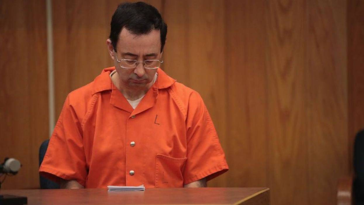 CHARLOTTE, MI - FEBRUARY 05: Larry Nassar sits in court listening to statements before being sentenced by Judge Janice Cunningham for three counts of criminal sexual assault in Eaton County Circuit Court on February 5, 2018 in Charlotte, Michigan. Nassar has been accused of sexually assaulting more than 150 girls and young women while he was a physician for USA Gymnastics and Michigan State University. Cunningham sentenced Nassar to 40 to 125 years in prison. He is currently serving a 60-year sentence in federal prison for possession of child pornography. Last month a judge in Ingham County, Michigan sentenced Nassar to an 40 to 175 years in prison after he plead guilty to sexually assaulting seven girls.