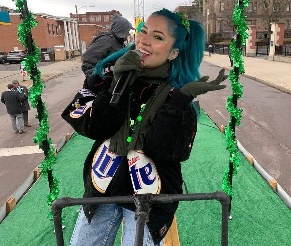 Charlotte Sands performing on KRZ float