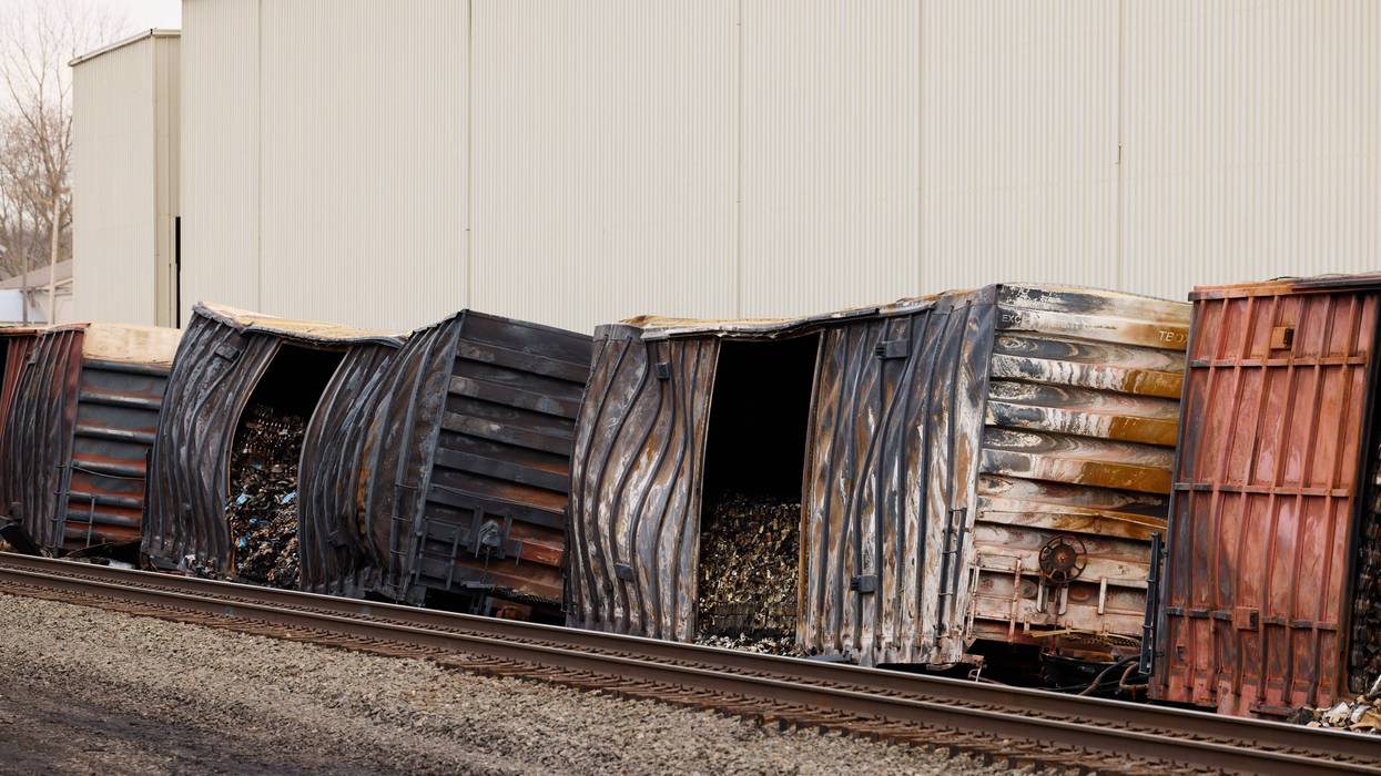 Charred train cars sit near railroad tracks on February 14, 2023 in East Palestine, Ohio. The Norfolk Southern train derailed on February 3, releasing toxic fumes and forcing evacuation of residents.