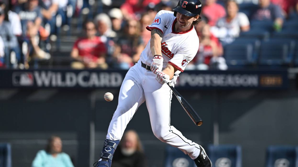 Chase DeLauter #34 of the Cleveland Guardians hits a single for his first career MLB hit during the second inning against the Detroit Tigers in game three of the American League Wild Card Series at Progressive Field on October 02, 2025 in Cleveland, Ohio