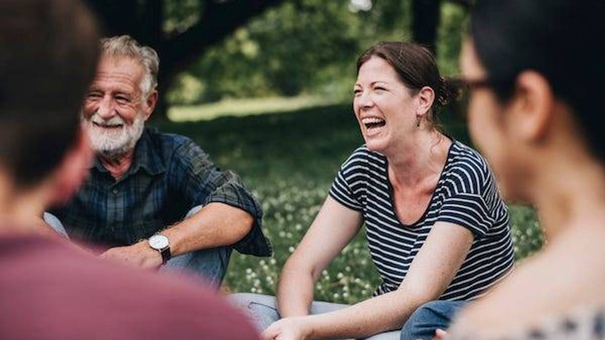 Cheerful woman in the park with her friends