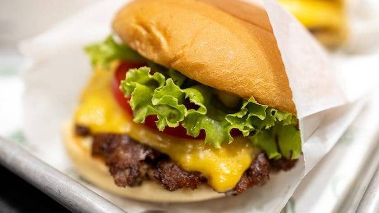 Cheeseburger in a wrapper at a restaurant