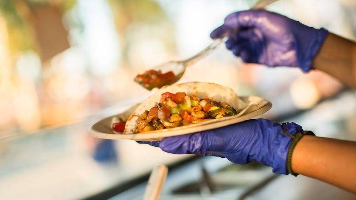 Chef preparing tacos in a food truck