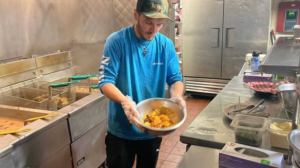 Chef preparing wings at Anchor Bar on Maple Rd. in Amherst