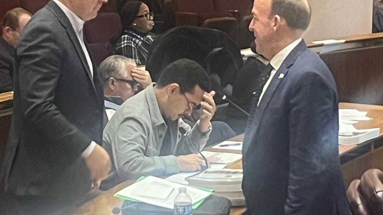 Chicago Alderman Brendan Reilly (42nd Ward, right) confers with fellow Alderman Bill Conway (34th Ward) during budget hearings at City Hall.