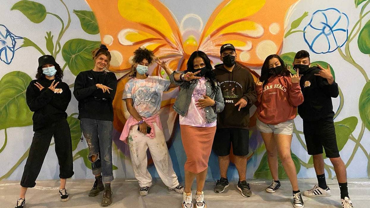 Chicago artists are at the border painting a mural inside one of the shelters housing asylum seeking kids.