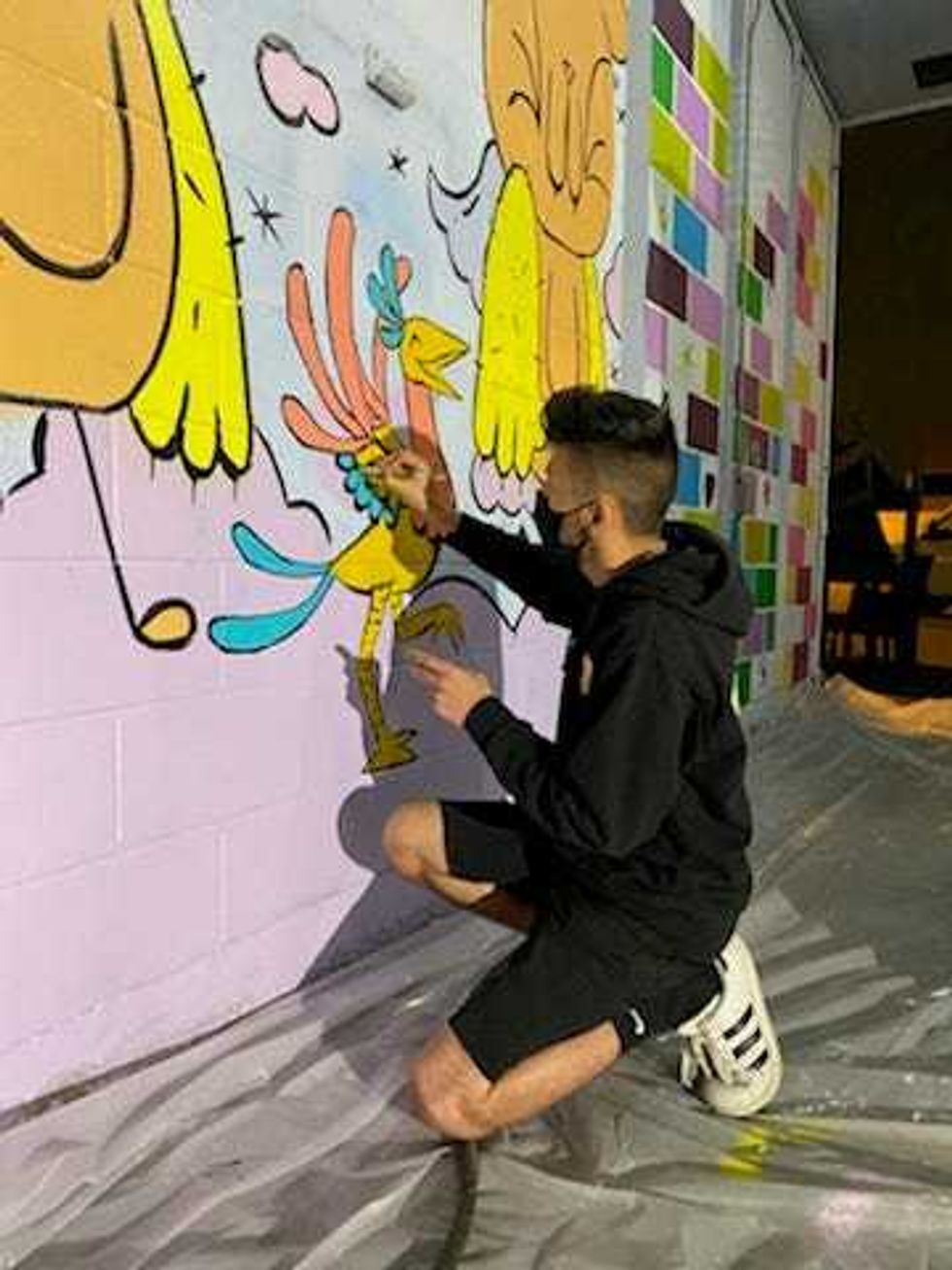 Chicago artists are at the border painting a mural inside one of the shelters housing asylum seeking kids.