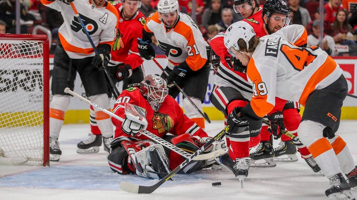 Chicago Blackhawks goaltender Robin Lehner (40) guards the net while the Philadelphia Flyers' Joel Farabee (49) looks to score amid second-period traffic at the United Center in Chicago on Thursday, Oct. 24, 2019.