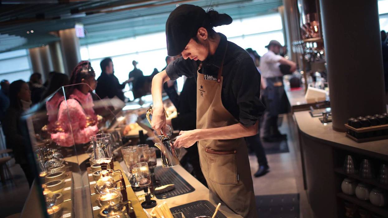 CHICAGO, ILLINOIS - NOVEMBER 12: A worker prepares drinks during a media preview at Starbucks Reserve Roastery on November 12, 2019 in Chicago, Illinois. With 35,000 square feet over four floors and a rooftop deck, the restaurant, which opens to the public on November 15, will be the company's largest. The restaurant features a cocktail bar, a reserve coffee bar, and experimental coffee bar and a bakery and cafe, each on separate levels.