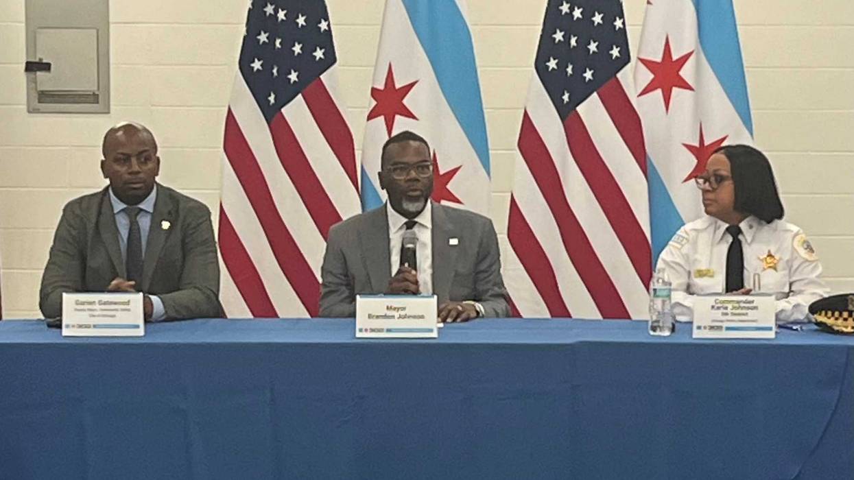 Chicago mayor Brandon Johnson (center) speaks during a violence roundtable in the Pullman neighborhood on Chicago's Far South side.
