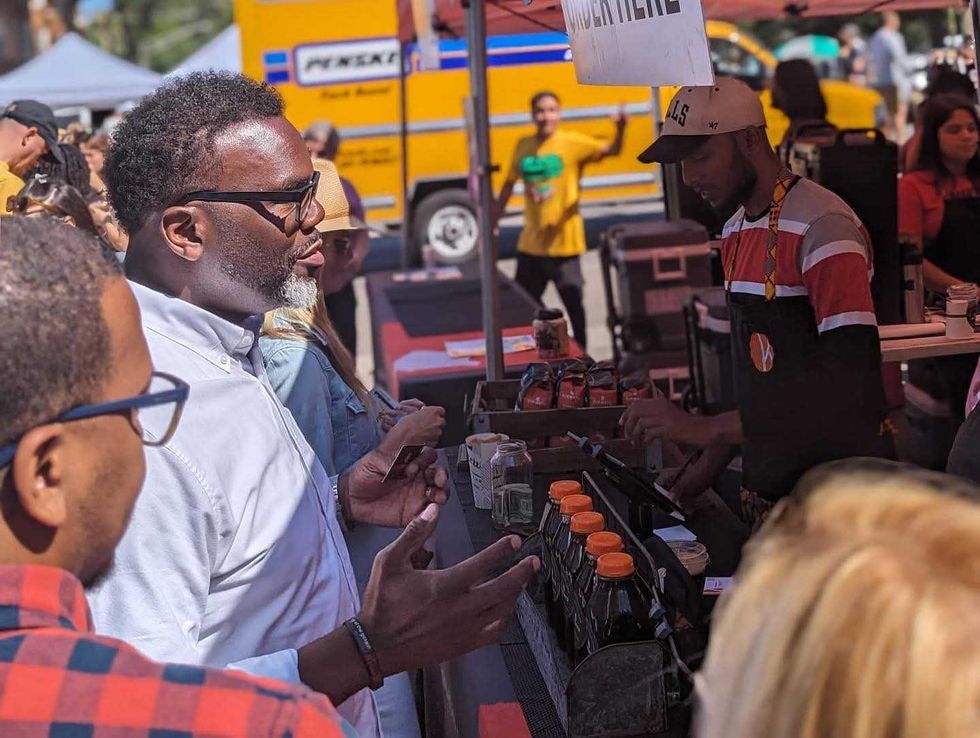 Chicago Mayor Brandon Johnson stops by the Kikwetu Coffee Company booth at the Logan Square Farmers Market August, 2023.