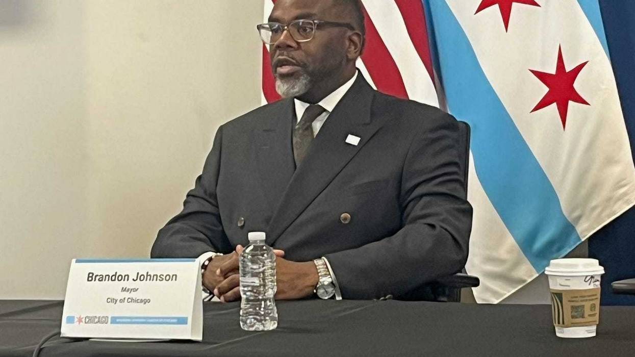 Chicago mayor Brandon Johnson talks to reporters at City Hall, October 28, 2025.