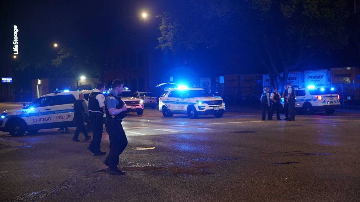 Chicago police gather at the intersection of Western Avenue and Fulton Street, where a police vehicle was rear-ended June 25, 2019.