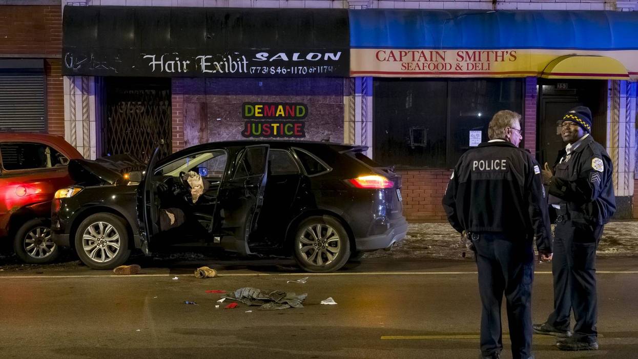 Chicago police work the scene where two people were shot including a 3-year-old during an attempted carjacking in the 7900 block of S. King Dr. in the Chatham neighborhood, Thursday, Jan. 13, 2022.