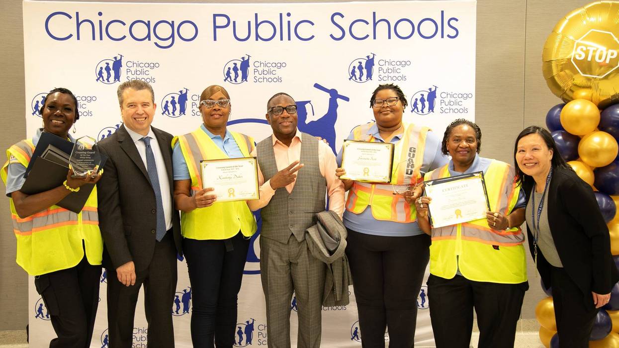 Chicago Public Schools' four "Crossing Guards of the Year" pose for a photo alongside district leaders.