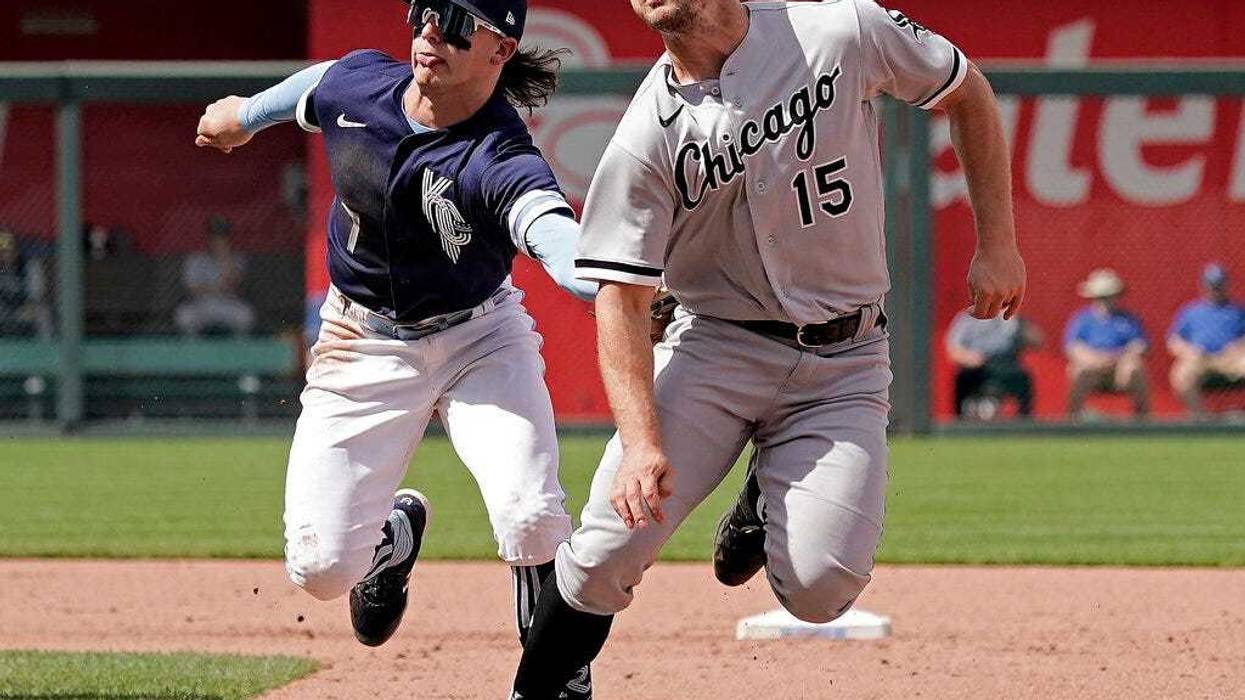 Chicago White Sox's Adam Engel (15) is tagged out by Kansas City Royals shortstop Bobby Witt Jr. as he is caught off base