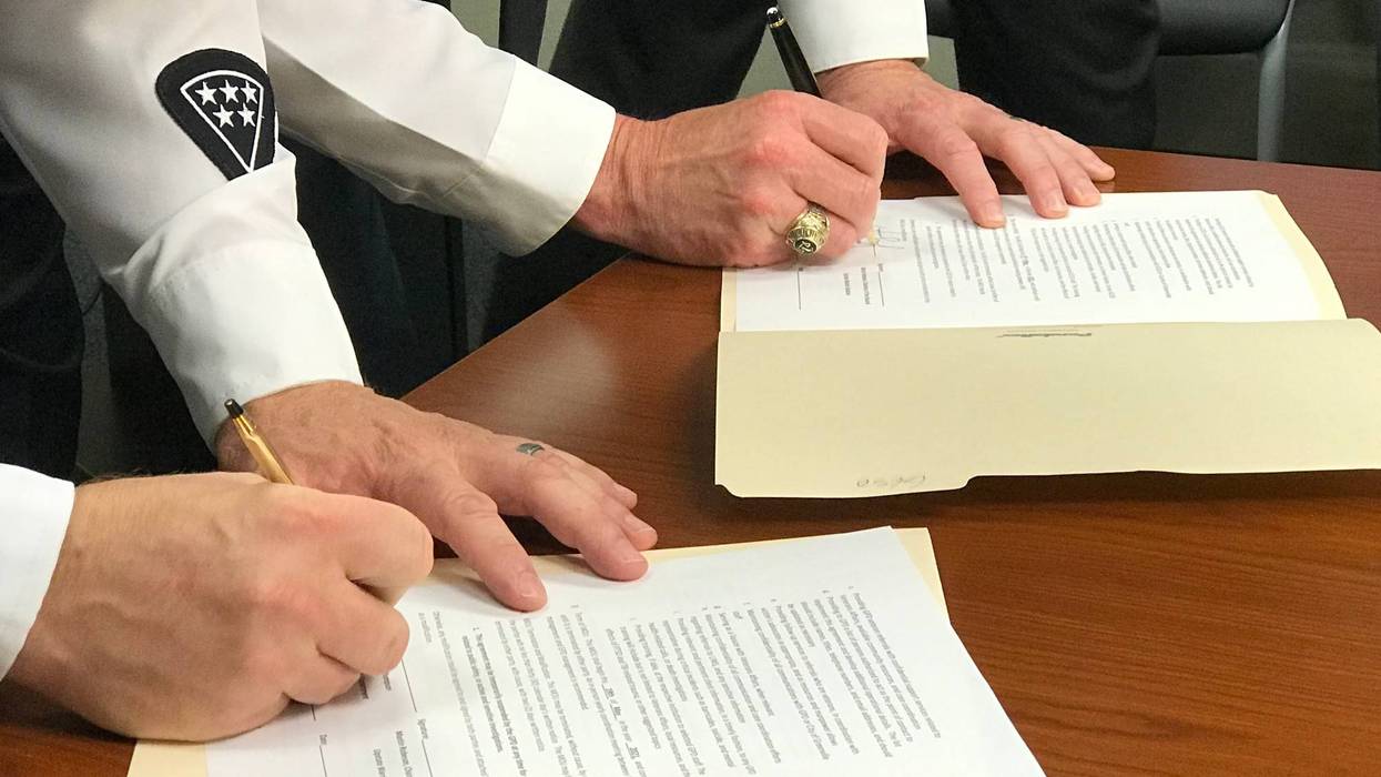 Chief Thompson and Sheriff H. Lewis sign Memorandum of Understanding with Upstate Warrior Solution