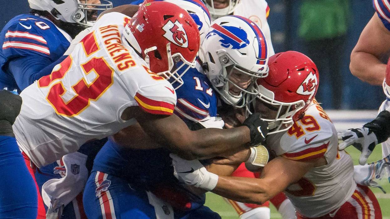 Chiefs defenders gang-tackle Bills QB Josh Allen during a Week 6 matchup.