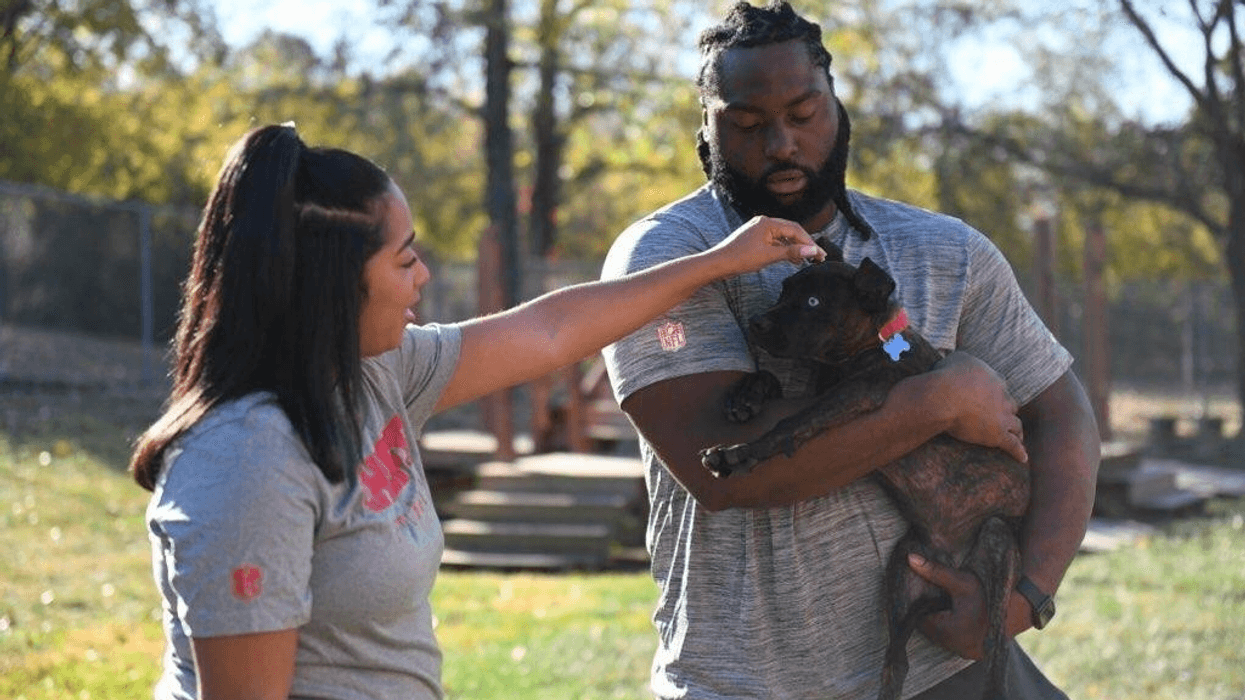 Chiefs player with puppy