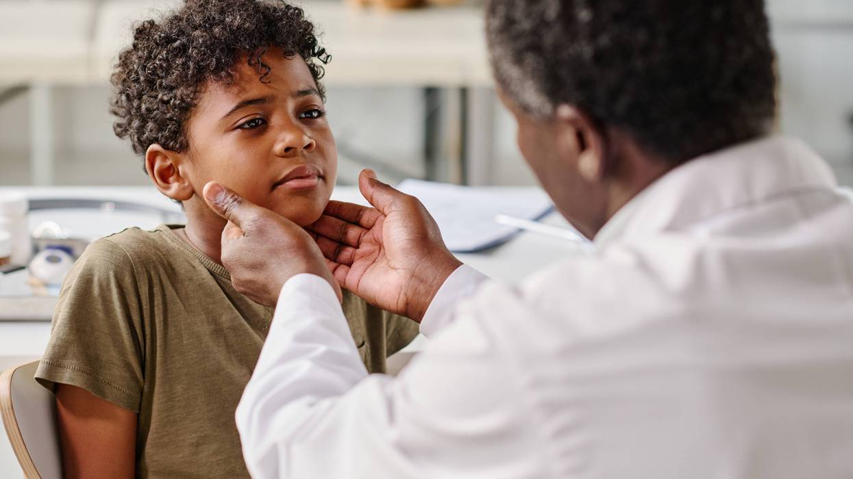Child being checked by a doctor