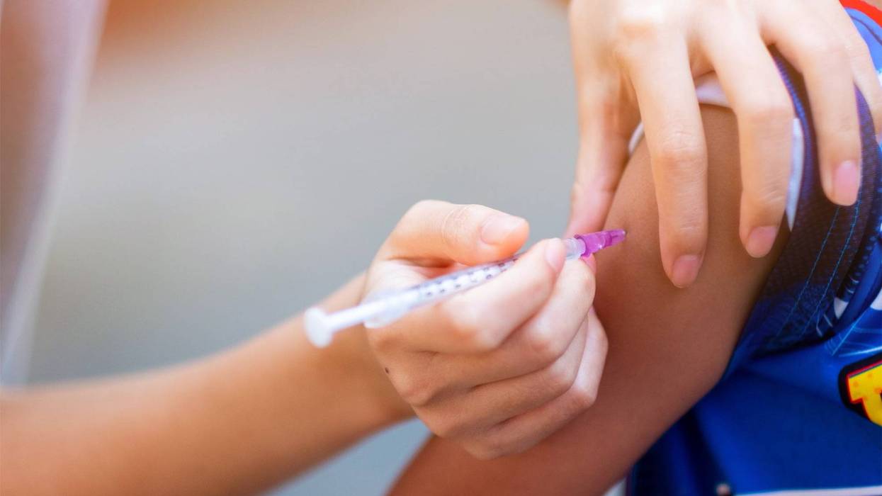 Child gets vaccination shot
