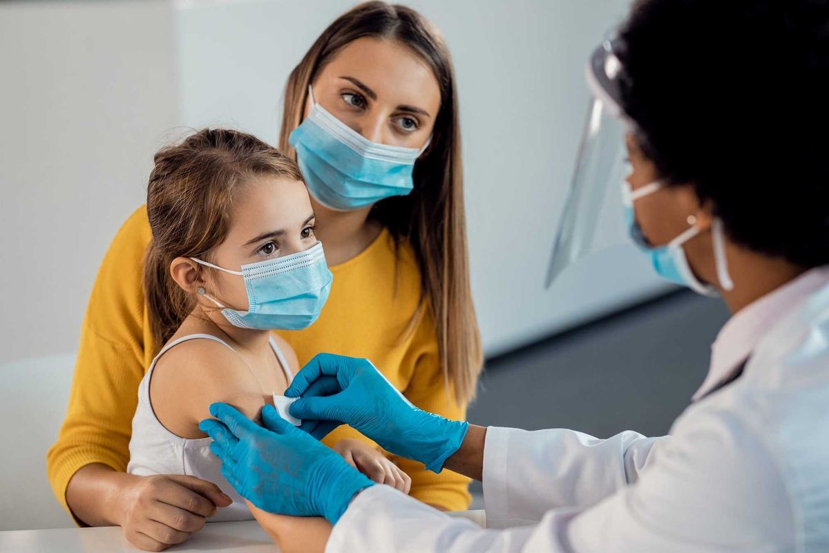 Child getting vaccine stock photo.
