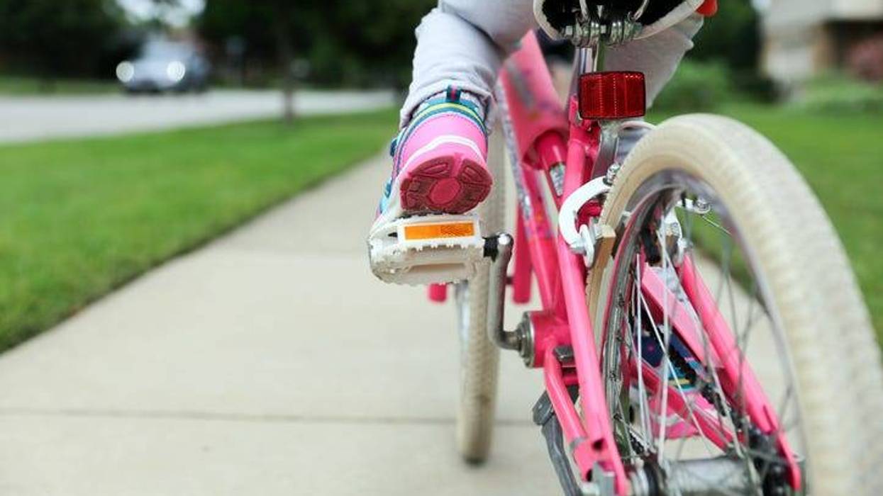 child on bike in a stock photo