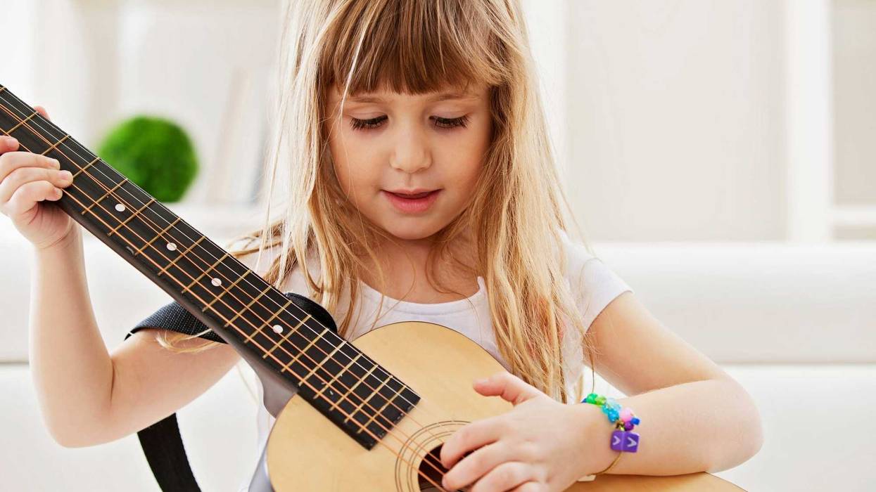 Child playing guitar