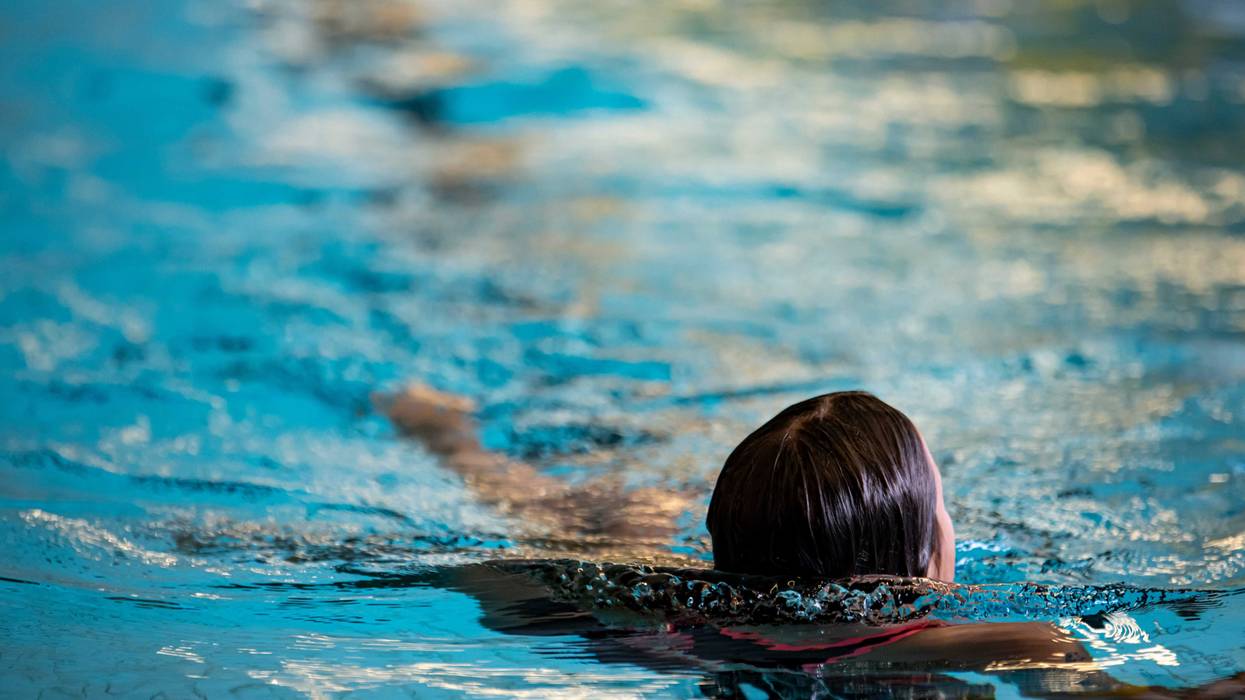 Child swimming in pool