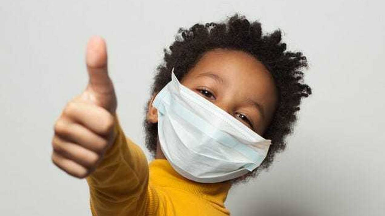 child wearing a mask