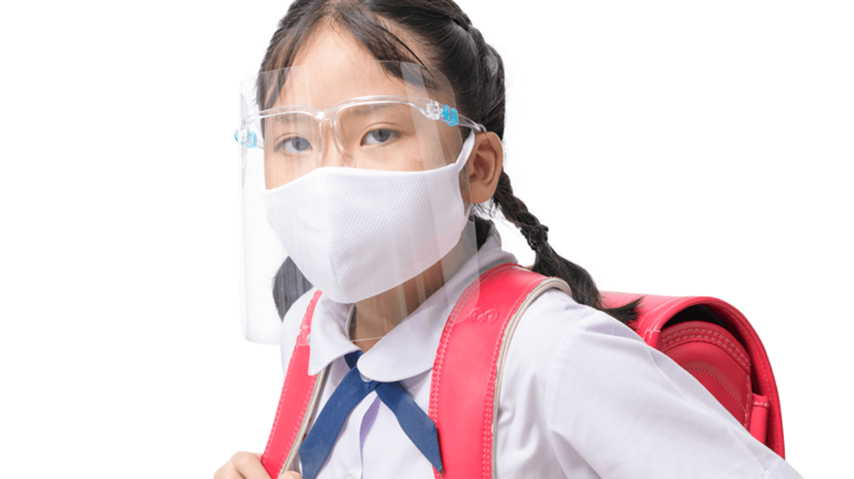 CHILD WEARING CLEAR FACE SHIELD