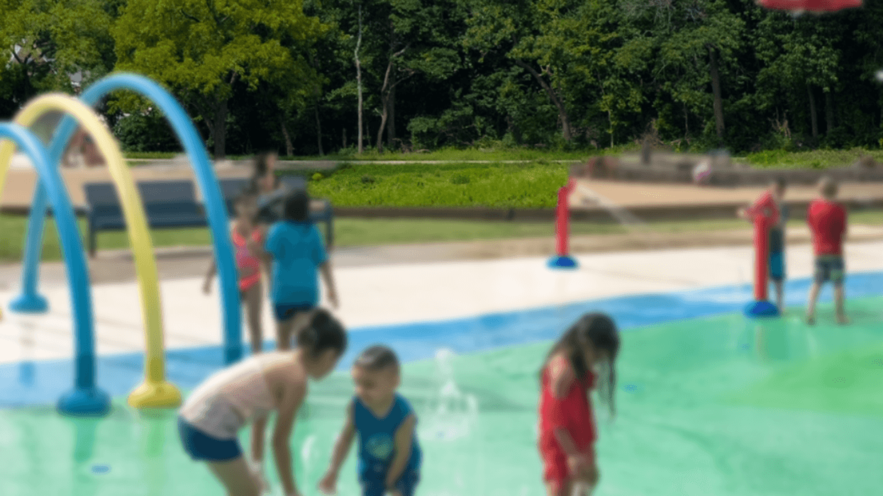 Children staying cool playing at a working splash pad.