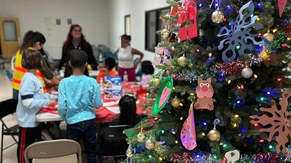 Children who arrived with migrant families in Philadelphia on Dec. 24 participate in Christmas activities at the welcome center in North Philadelphia.