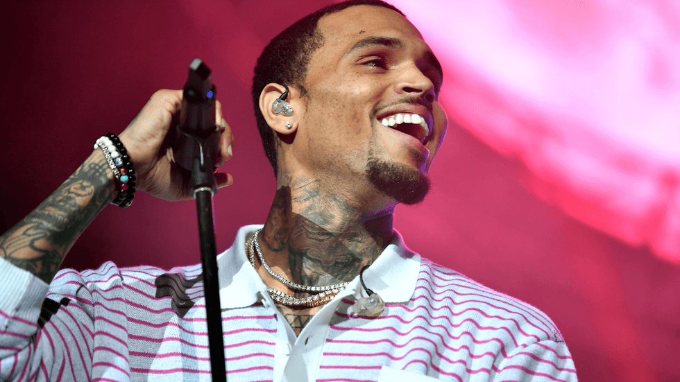 Chris Brown is all smiles with his 100k 24-karat gold grills