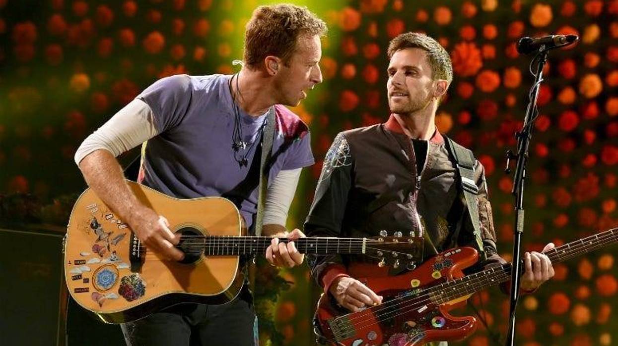 Chris Martin (L) and Guy Berryman of Coldplay perform at the Rose Bowl on October 6, 2017