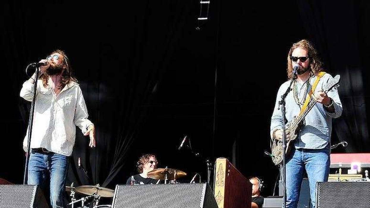 Chris Robinson and Rich Robinson of The Black Crowes perform in concert.