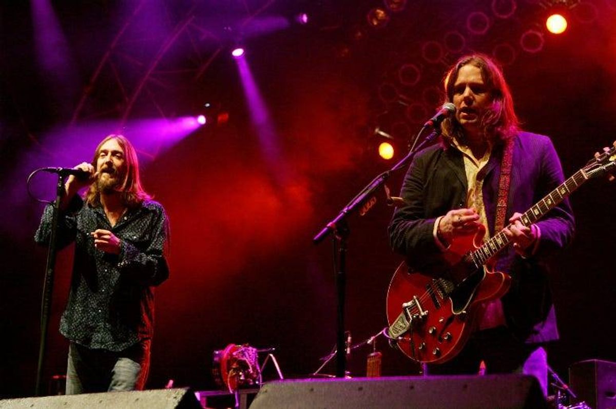 Chris Robinson (L), and his brother, guitarist Rich Robinson of The Black Crowes, perform at the Vegoose music festival