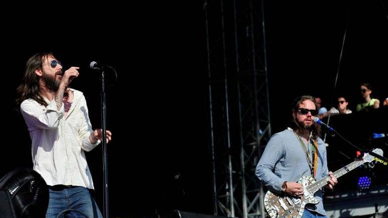 Chris Robinson (L) and Rich Robinson of the Black Crowes perform at Hard Rock Calling in 2013