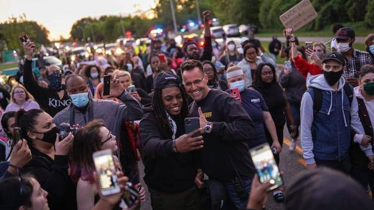 Chris Swanson, Genesee County Sheriff, Police, Selfie, March, Protest, Crowd