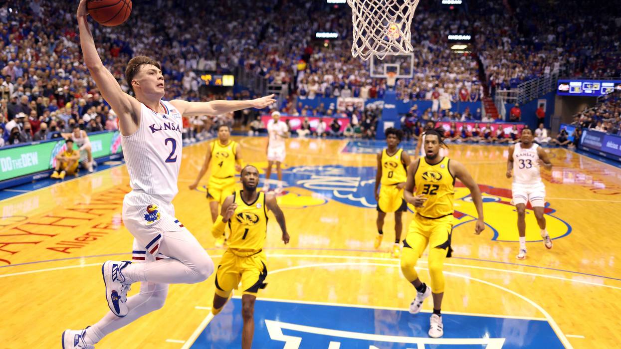 Christian Braun #2 of the Kansas Jayhawks scores on a fast break during the game against the Missouri Tigers at Allen Fieldhouse on December 11, 2021 in Lawrence, Kansas.