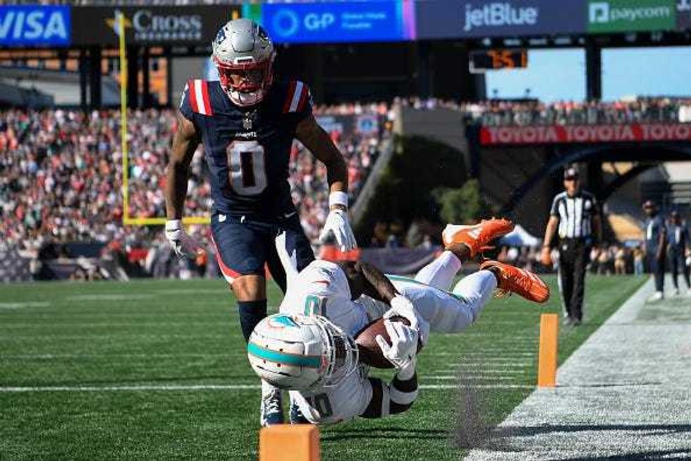 Christian Gonzalez and Tyreek Hill