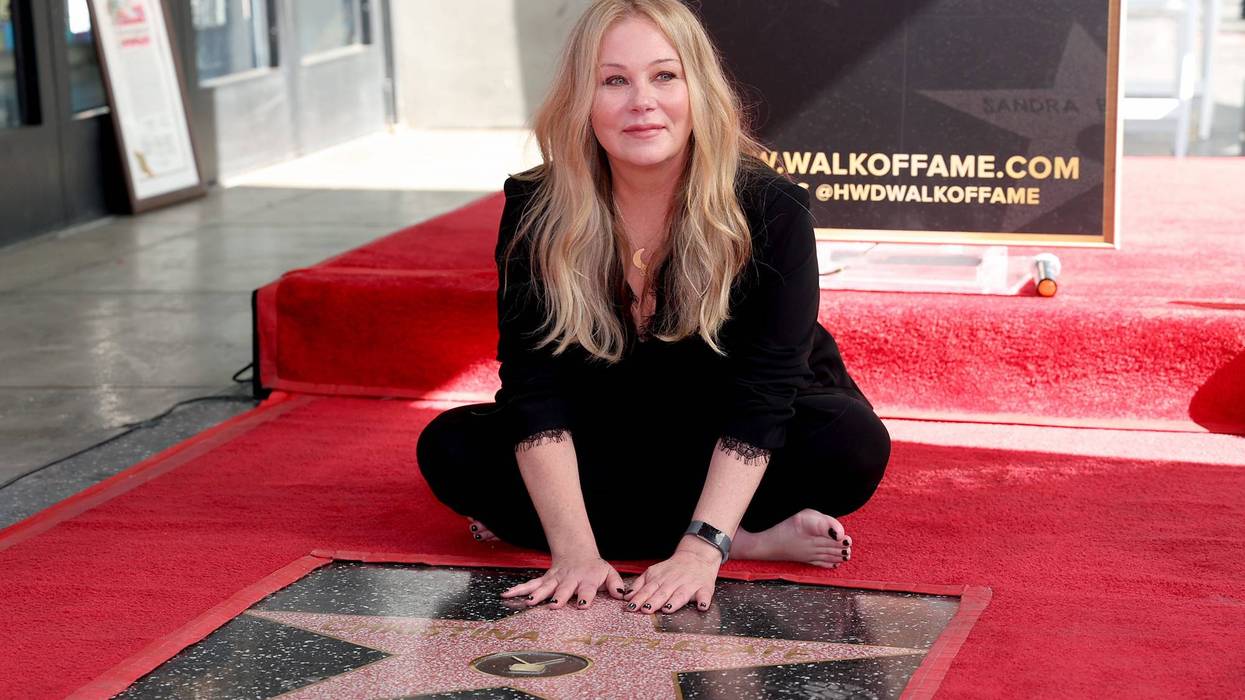 Christina Applegate poses with her star during her Hollywood Walk of Fame Ceremony at Hollywood Walk Of Fame on November 14, 2022 in Los Angeles, California.