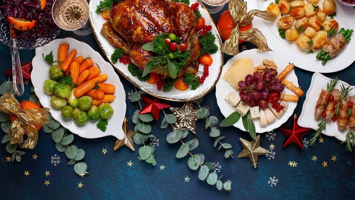 Christmas dinner with roasted chicken and various vegetables dishes