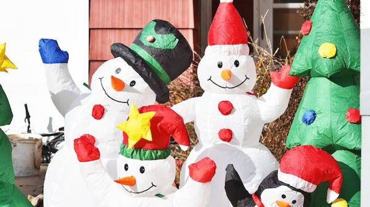 Christmas inflatables on display in yard