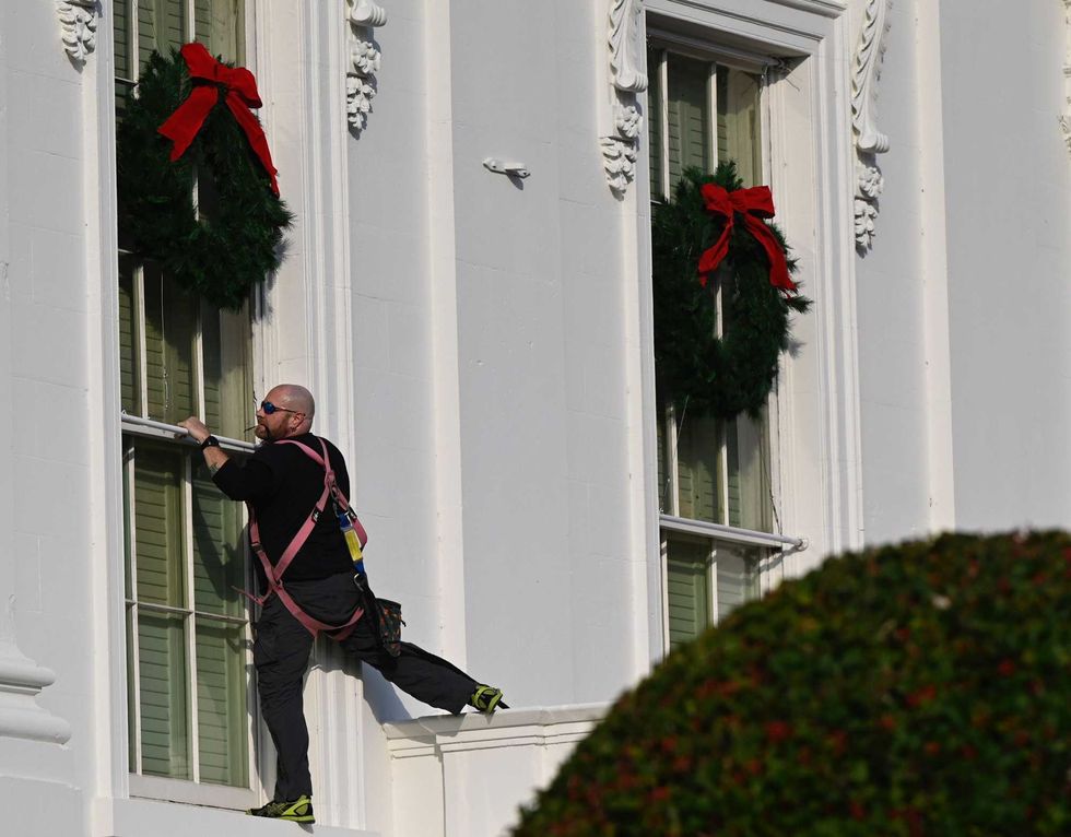 Christmas wreaths are installed at the White House in Washington, DC, on November 21, 2020.