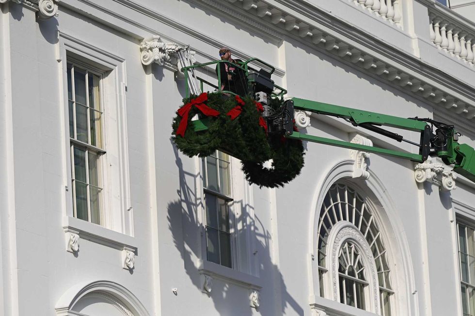 Christmas wreaths are installed at the White House in Washington, DC, on November 21, 2020.
